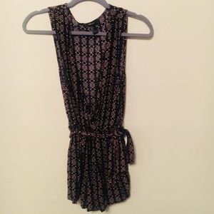 Black romper with orange design